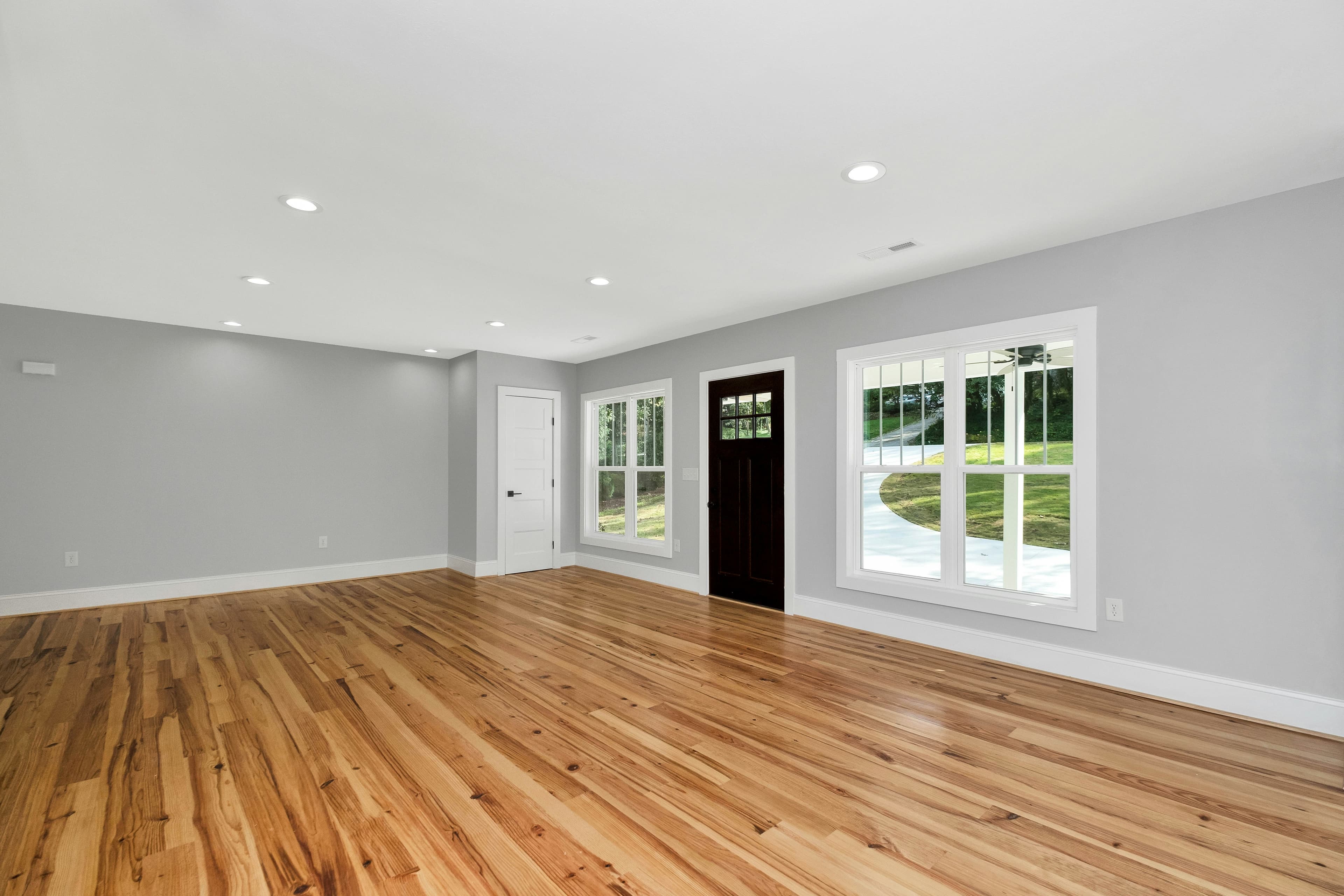 Light-toned hardwood floor after sanding and sealing with a smooth matte finish.